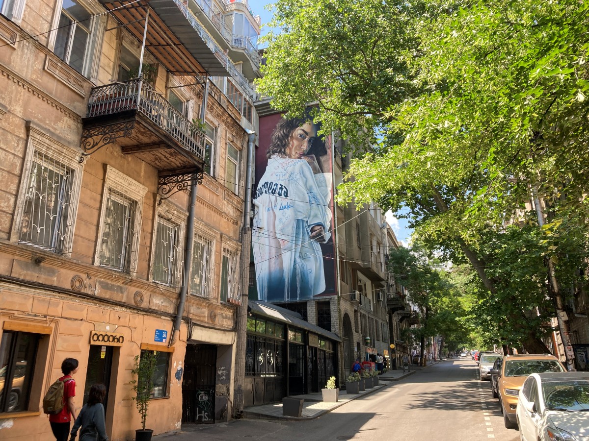 Ornate balconies and fine graffiti in Tbilisi’s tree-lined streets